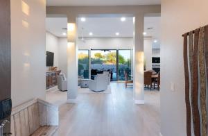 a living room with a dining room and a kitchen at Scottsdale Luxury Heated Pool Desert Views For 6 in Scottsdale