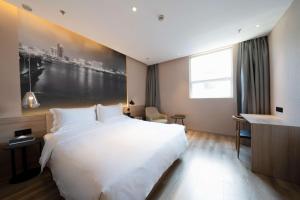 Postel nebo postele na pokoji v ubytování Youth Sunshine S Hotel Tianhong Songbai Branch