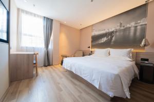 Postel nebo postele na pokoji v ubytování Youth Sunshine S Hotel Tianhong Songbai Branch