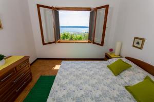 A bed or beds in a room at Villa Bobica Split
