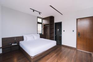Postel nebo postele na pokoji v ubytování Scenery Hotel DaLat