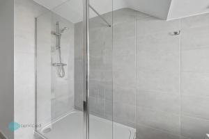 a shower with a glass door in a bathroom at 2 Bed - Apartment No. 1 Windsor Villas in Plymouth