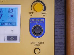 a remote control with the words good night and earth room at APA Hotel Akihabara Ekimae in Tokyo