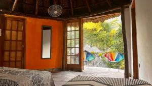 Ein Bett oder Betten in einem Zimmer der Unterkunft Tawaca Ecohotel