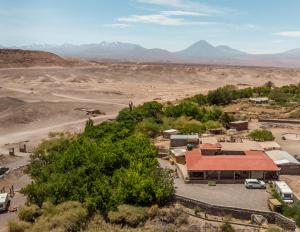 an aerial view of a building in the desert at Vientos San Pedro in San Pedro de Atacama