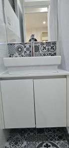a white bathroom counter with a sink and a mirror at Yanahuara HOTEL PLAZA in Yanahuara