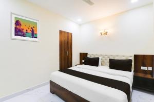 Postel nebo postele na pokoji v ubytování Hotel O Manglam Hotel + 24 fotografií