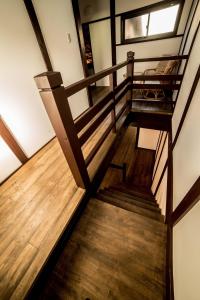 Postel nebo postele na pokoji v ubytování 京町家一棟貸しKyoto Machiya Stay En