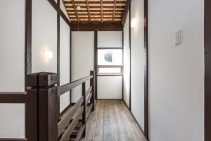 Postel nebo postele na pokoji v ubytování 京町家一棟貸しKyoto Machiya Stay En