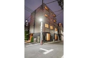 a building with a street light in front of it at 67 Apartment Ueno in Tokyo