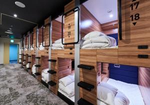Postel nebo postele na pokoji v ubytování LiVEMAX RESORT Kaga Yamashiro