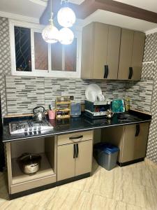 a kitchen with a sink and a counter top at Nador corniche gare in Nador