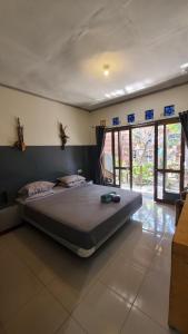 Postel nebo postele na pokoji v ubytování Bintang Guesthouse