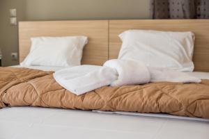 Posteľ alebo postele v izbe v ubytovaní Golden Sun Villas