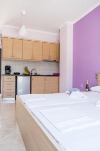 Posteľ alebo postele v izbe v ubytovaní Golden Sun Villas