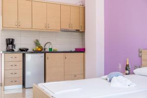 Posteľ alebo postele v izbe v ubytovaní Golden Sun Villas