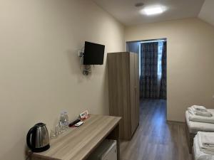 Televiisor ja/või meelelahutuskeskus majutusasutuses Olive hotel