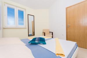 Postel nebo postele na pokoji v ubytování Apartment Ljuba