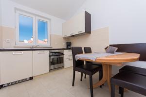 Kuchyň nebo kuchyňský kout v ubytování Apartment Ljuba