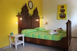 A bed or beds in a room at La Fattoria Delle Tartarughe