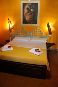 A bed or beds in a room at La Fattoria Delle Tartarughe