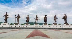 a group of statues of men standing in a field at Greenfield Valley Fishing Resort in Hua Hin