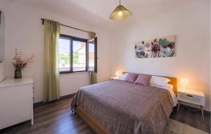 Posteľ alebo postele v izbe v ubytovaní Holiday Home Koromani V