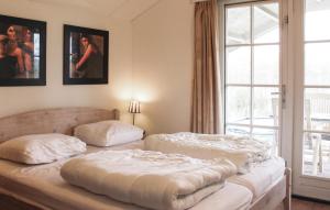 En eller flere senge i et værelse på Buitengoed Het Lageveld - 59