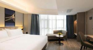 Ein Bett oder Betten in einem Zimmer der Unterkunft Nanning Prince Hotel
