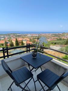 a table and chairs on a balcony with a view at B&B Le Giadali in Praia a Mare