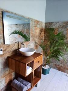 a bathroom with a sink and a mirror at Iki Room with Jacuzzy in Fortuna +19 photos