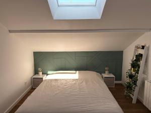 Uma cama ou camas num quarto em Le coin caché