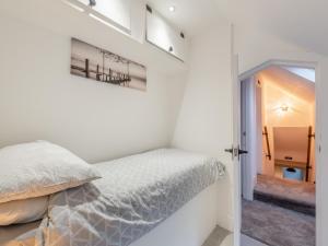 Postel nebo postele na pokoji v ubytování Poulter Cottage