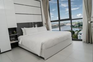 Postel nebo postele na pokoji v ubytování Noden Hotel & Apartment