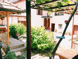 a view of a garden from the outside of a house at Guest house Nizama's Place in Sarajevo