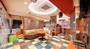 a living room with a colorful floor at Hotel S Shinchon in Seoul