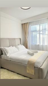 Una cama o camas en una habitación de Brickford heights kilimani