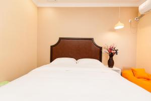 Weiyi Boutique Hotel客房内的一张或多张床位