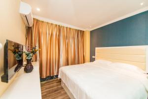 Weiyi Boutique Hotel客房内的一张或多张床位