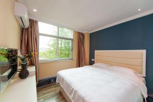 Weiyi Boutique Hotel客房内的一张或多张床位