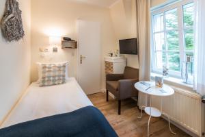 Tempat tidur dalam kamar di Hotel kleine Auszeit - Adults Only