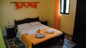 A bed or beds in a room at Ktima Nikola