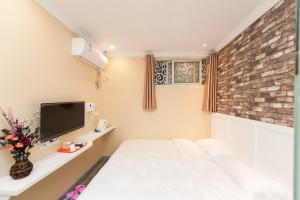 Weiyi Boutique Hotel客房内的一张或多张床位