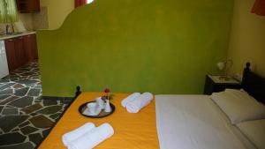 A bed or beds in a room at Ktima Nikola