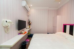 Weiyi Boutique Hotel客房内的一张或多张床位