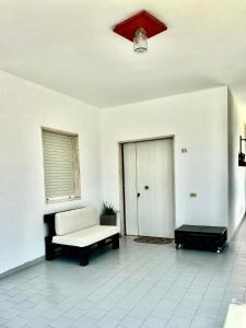 a living room with a couch and a table at Villa Amaryllis in Pulsano