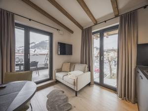 Μια τηλεόραση ή/και κέντρο ψυχαγωγίας στο Apartment in Kirchberg near Ski Lift