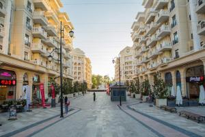 a street in a city with tall buildings at Luxury Apartment Tashkent City boulevard Happy Home in Tashkent