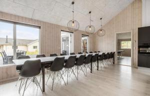 a conference room with a long table and chairs at Nice Home In Vejby With Sauna in Vejby