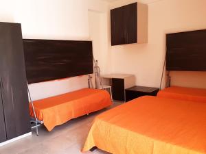 A bed or beds in a room at L'Isola del Sale